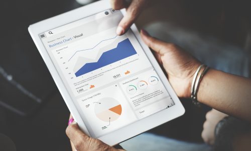 Hands Using Tablet Screen Showing Statistics Business Data
