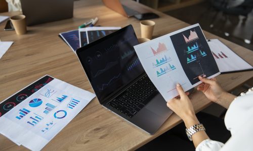 office-worker-using-finance-graphs